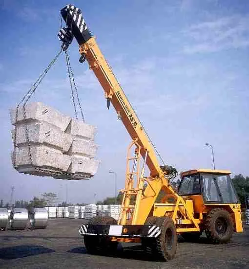 Heavy crane lifting materials at a mining infrastructure site